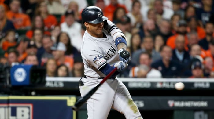 Oct 12, 2019; Houston, TX, USA; New York Yankees second baseman Gleyber Torres (25) hits an RBI double against the Houston Astros in the fourth inning in game one of the 2019 ALCS playoff baseball series at Minute Maid Park. Mandatory Credit: Troy Taormina-USA TODAY Sports